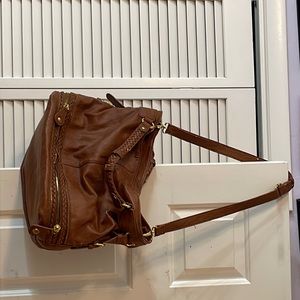 Used Urban Expressions brown purse! Alil shredding of pleather. Decent condition